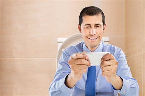 Man Sitting On Toilet Stock Photos Pictures And Royalty Free Images Istock
