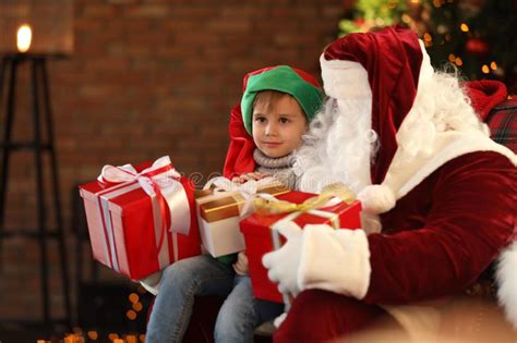 Santa Claus And Little Boy With Christmas Ts Stock Image Image Of