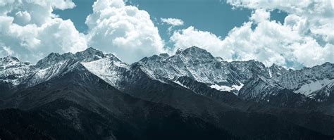 Download Wallpaper 2560x1080 Mountains Peaks Clouds Snowy Landscape