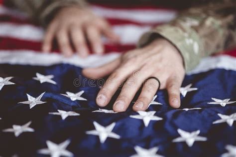 American Soldier Mourning And Praying With The American Flag And The