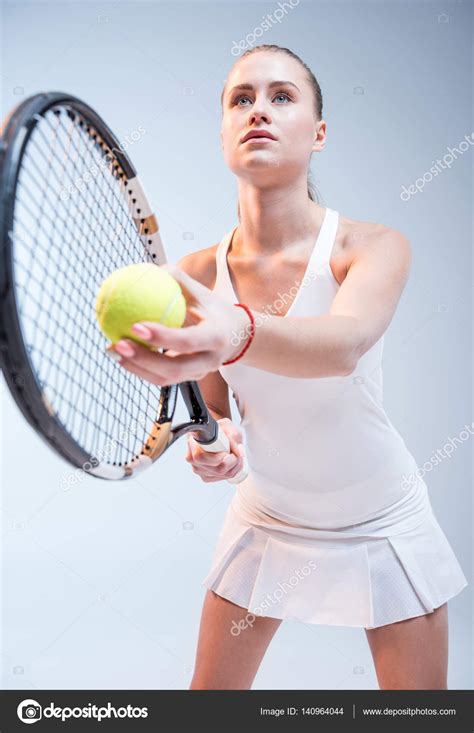 Young Woman Playing Tennis — Stock Photo © Dmitrypoch 140964044