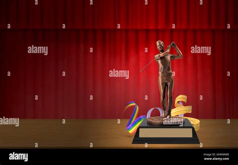 Gold Silver And Bronze Trophy Cups On Stage In Front Of Red Curtain To