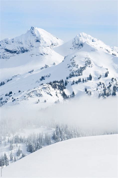 Snow Covered Mountains In Winter By Stocksy Contributor Mark Windom