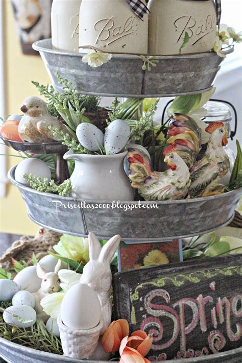 A Three Tiered Tray Filled With Eggs And Other Decorations On Top Of A