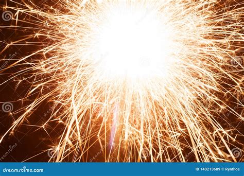 Bright Sparkler With Sparks Flying At Night Stock Image Image Of