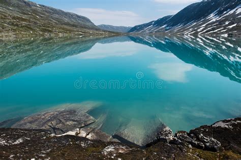 Landscape With Turquoise Mountain Lake Surrounded By Mountains Norway