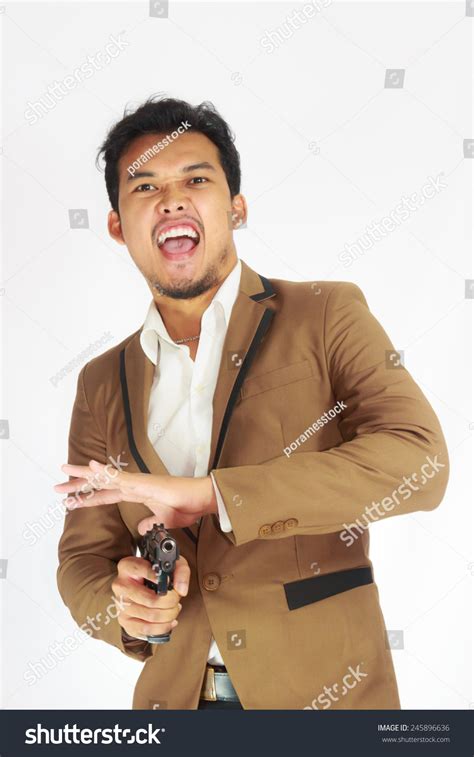 Mature Business Man Holding Gun Stock Photo 245896636 Shutterstock
