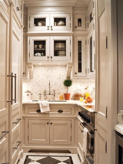 Glass cabinet doors and a solid glass backsplash are obvious. 45 Creative Small Kitchen Design Ideas | DigsDigs