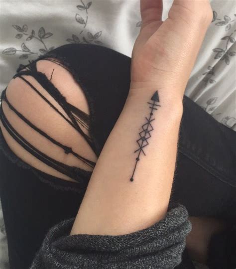 Small crescent moon tattoo on the wrist. Arrow mandala style black tattoo small side of wrist first ...
