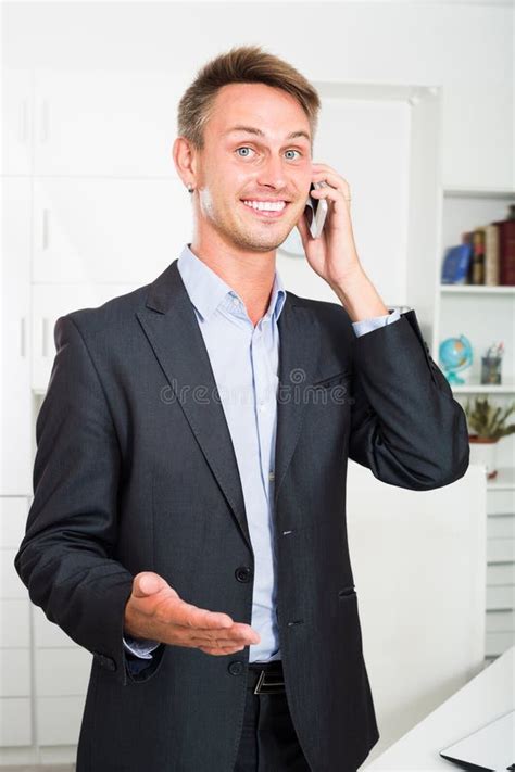 Cheerful Man Talking On Mobile Phone At Office Stock Photo Image Of