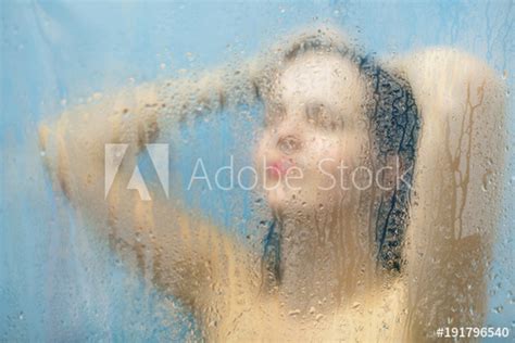 Beautiful Young Woman With Naked Body Takes Shower Behind