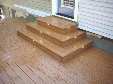 Timbertech deck lighting is offered in six different styles to create function and beauty. Timbertech Pacific teak deck with lights | Deck Masters, LLC
