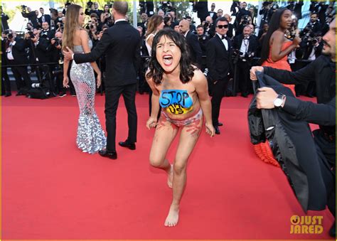 Topless Protester Storms The Red Carpet At Cannes Premiere See