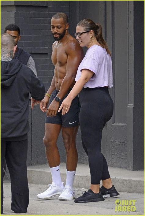 ashley graham and husband justin ervin display their strength during an outdoor workout photo