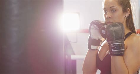 Hard Hitting Female Boxer Training In Boxing Club Stock Video Footage