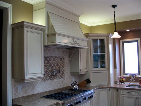 Make sure that the caps and heads are placed in the correct locations. Large Decorative Range Hood above 48" Gas cooktop. Note ...