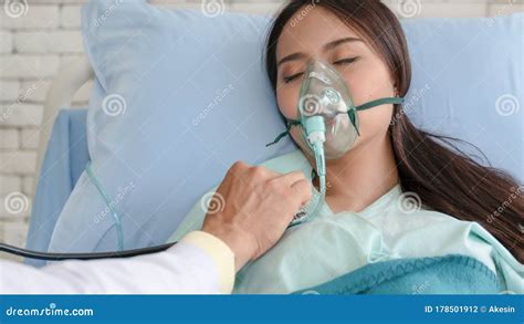 Asian Woman Patient On Bed In Hospital With Wearing Oxygen Mask Stock