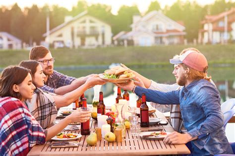 Friends Eating Burgers Stock Photo Download Image Now Istock