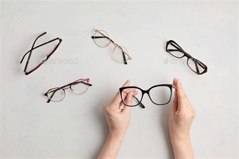 Woman Hand Holding Eyeglasses Optical Store Glasses Selection Eye Test Vision Examination At