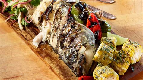 Whole Grilled Black Bass With Charred Pepper Kohlrabi And Herb Salad And Corn On The Cob With