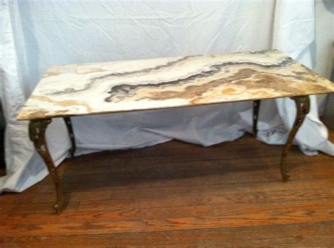 Enjoy free shipping & browse our great selection of living room furniture, coffee tables, console & sofa wayfair has thousands of coffee tables in a myriad of shapes, materials and styles. Stone-top coffee table with brass leaf-shaped legs antique ...