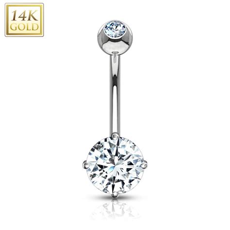Bijou de piercing pour le nombril en acier chirurgical avec 2 brillants blancs ronds de swarovski ®, sertis.le strass du bas est entouré de mini boules.modèle original et distingué. Piercing nombril Or Blanc 14 carats Pierre Zirconium blanche