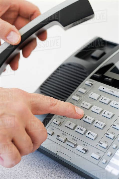 Man Dialing Telephone Stock Photo Dissolve