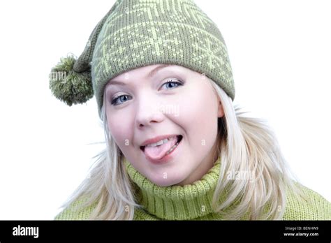 Portrait Of Beautiful Playful Blonde Girl In Green Sweater And Winter