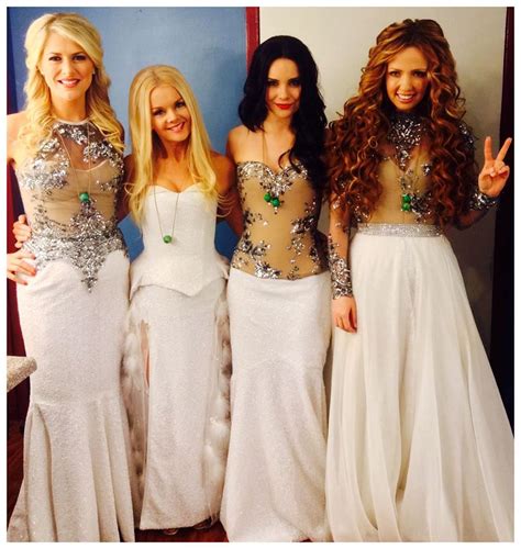 Celtic Woman Members Past And Present They Stand Outside A Castle To