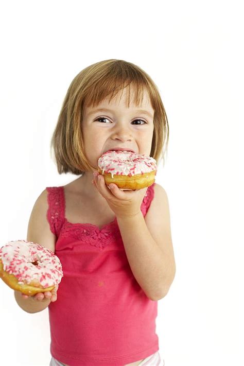 Girl Eating A Donut Wallpaper Photos