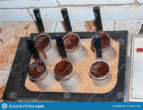 Traditional Turkish Coffee With Foam In Cezve Prepared On Hot Sand In