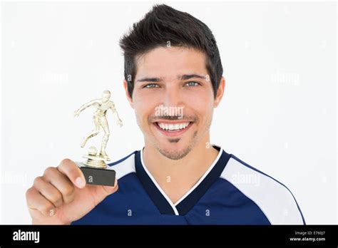 Football Player Holding Winners Trophy Stock Photo Alamy