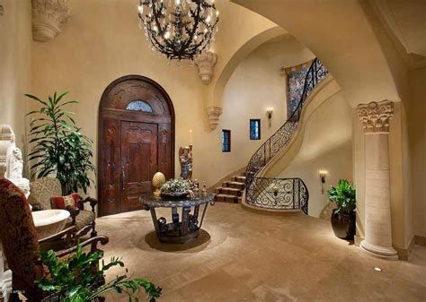 Mediterranean Style Foyer With Winding Staircase Arched Front Door And