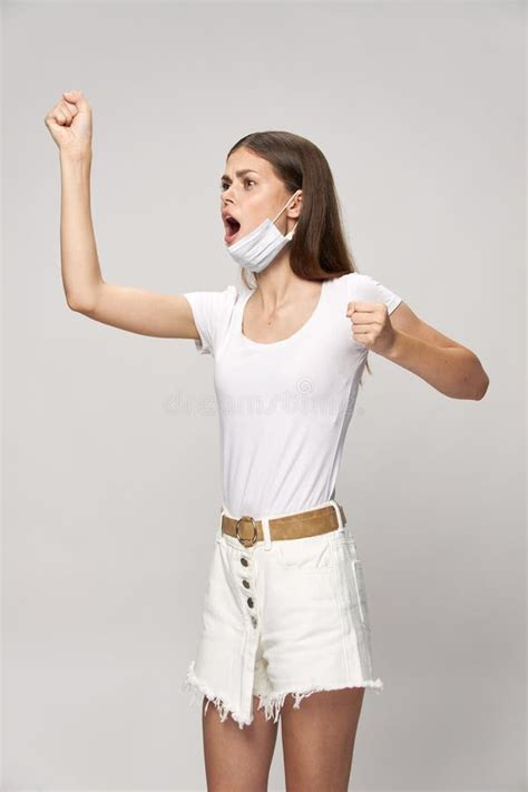 A Woman With An Open Mouth In A Medical Mask Clenched Her Hands Into A Fist Stock Image Image