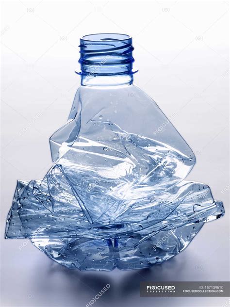 Closeup View Of Crushed And Empty Plastic Water Bottle Background Details Stock Photo