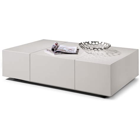 All other furniture is organized around them. Sleek Modern Coffee Table with Hidden Storage