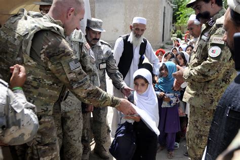 Us Army Col Richard Johnson Left And Afghan Border Police Hand Out