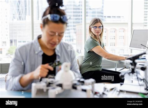 Female Robotics Engineers Working In Laboratory Stock Photo Alamy