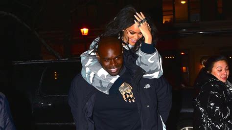 Rihanna Gets A Piggyback Ride From Her Security Guard Before Heading To