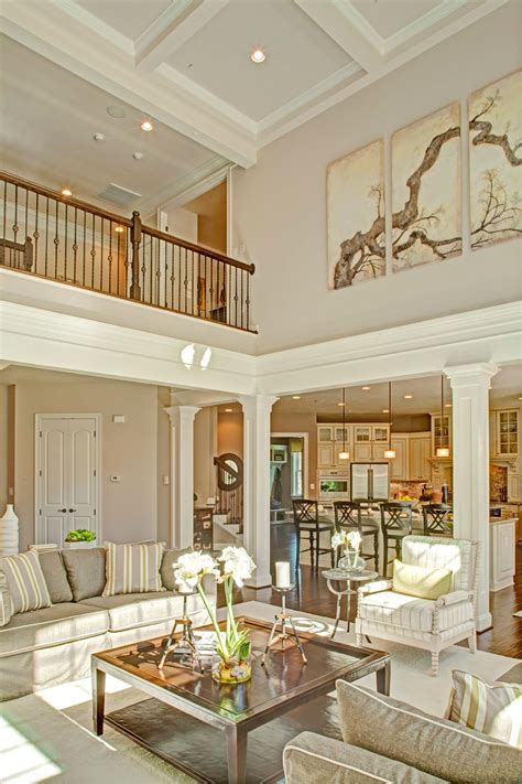Matching the wood to furniture in the room (like these chairs) helps tie the entire space together. two story family room with coffered ceiling - Google ...