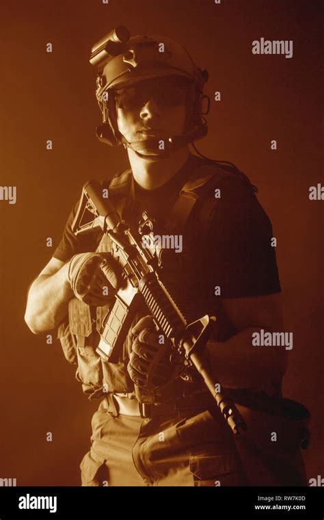 Private Military Contractor Pmc With Assault Rifle On Dark Background