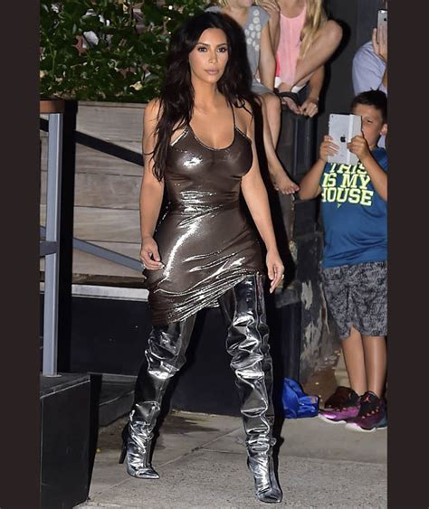 Kim Kardashian Wears Racy See Though Dress And Matching Silver Boots