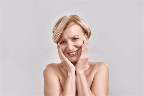 Close Up Portrait Of Beautiful Middle Aged Woman Playfully Looking At