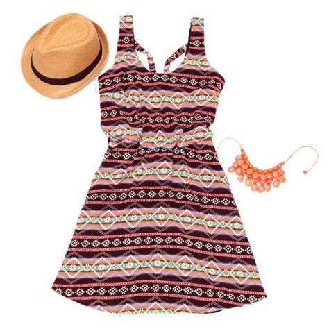 A Straw Fedora A Tribal Print Dress And A Coral Statement Necklace