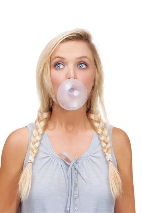 Practising Her Bubble Blowing A Young Blonde Woman Blowing A Bubblegum Bubble Stock Image