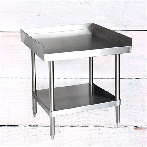 The table's overall shape and stance gives this piece artistic dimension and is elegantly de. 24" x 24" 304 Stainless Steel Table with Undershelf (16-Gauge)