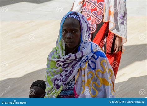 Unidentified Senegalese Woman In Colored Traditional Clothes An