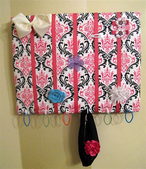 I started by painting decoupage medium on the front of a large k that we bought at michaels, then smoothed some really cute scrapbooking paper over it. Easy Hair Bow Holder - A Crafty Mom