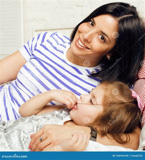Portrait Of Mother And Daughter Laying In Bed And Smiling Close Stock Image Image Of Sleeping