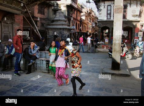 nepal kathmandu street people unesco patan durbar lalitpur girl walk play game